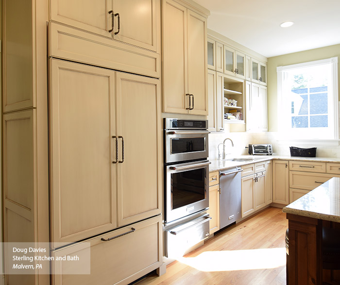 Off white glazed cabinets in a casual kitchen